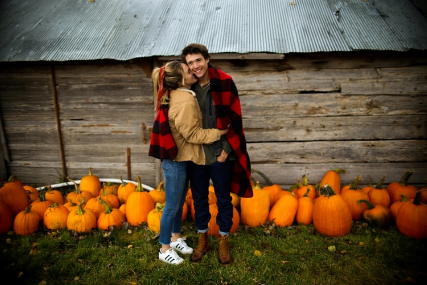 couple in pumpkin patch