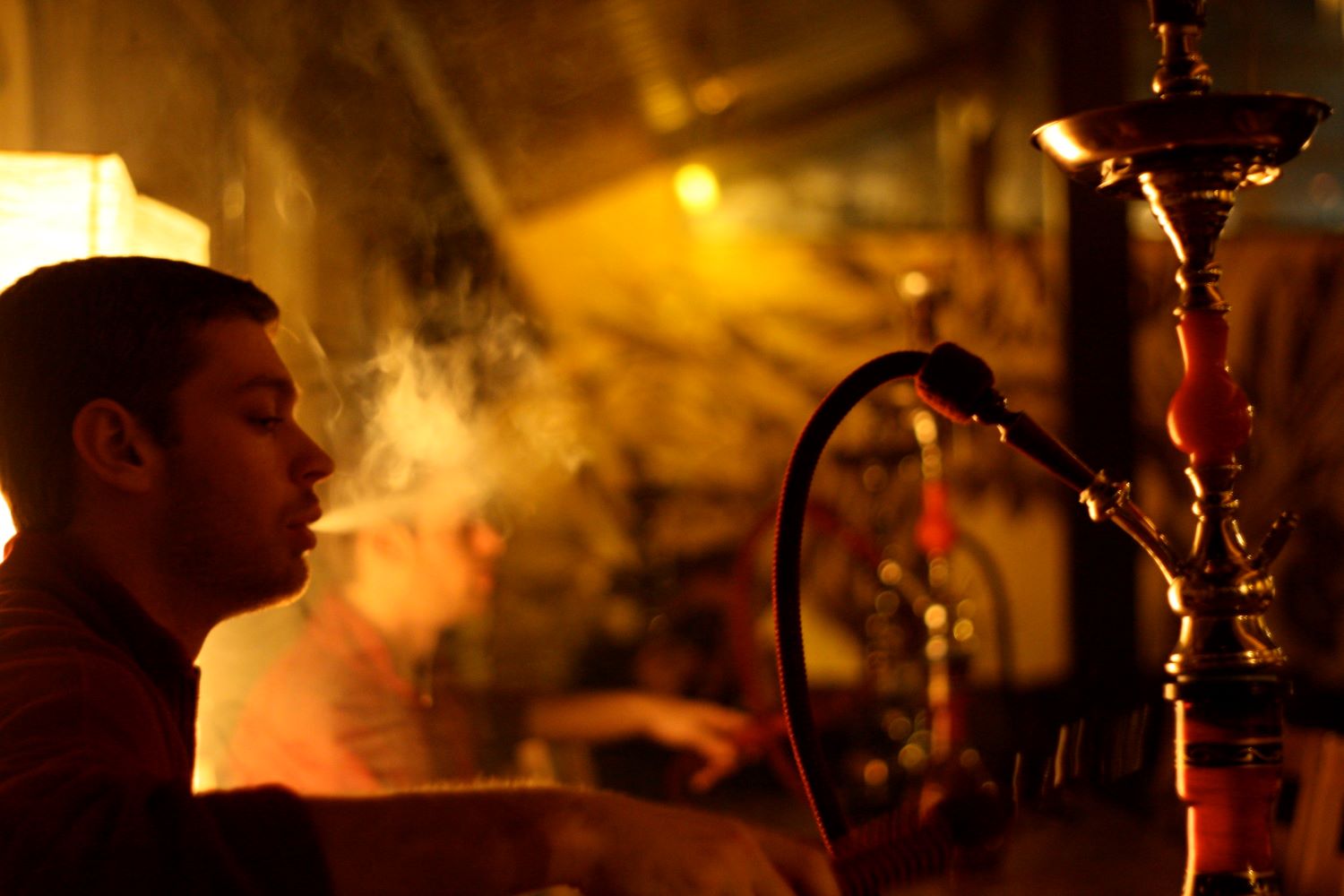 person smoking shisha