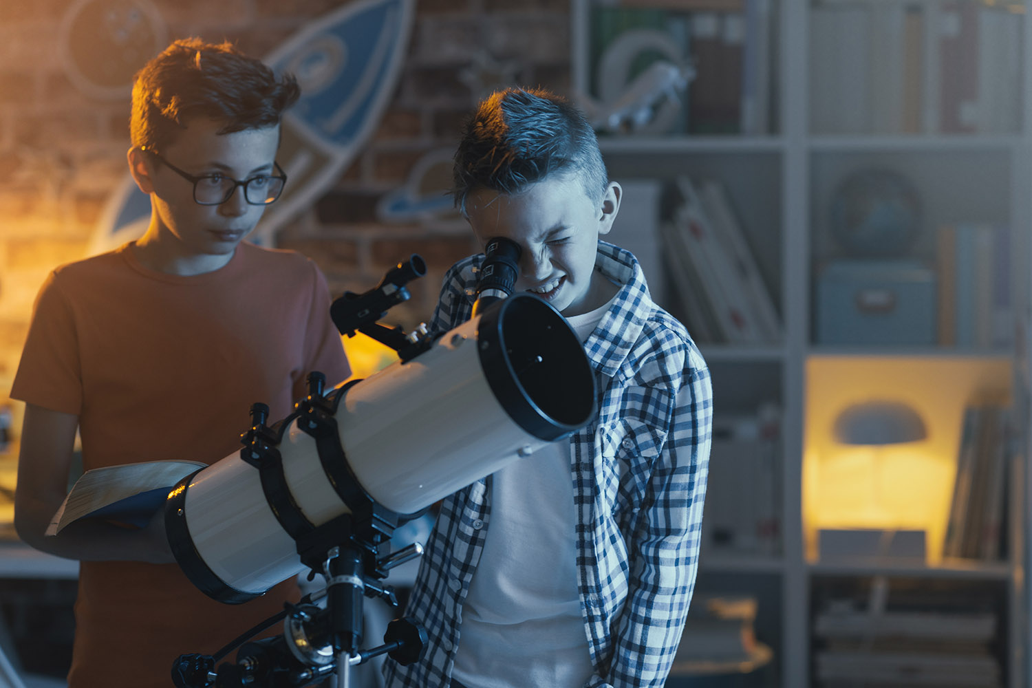kids with telescope looking out window