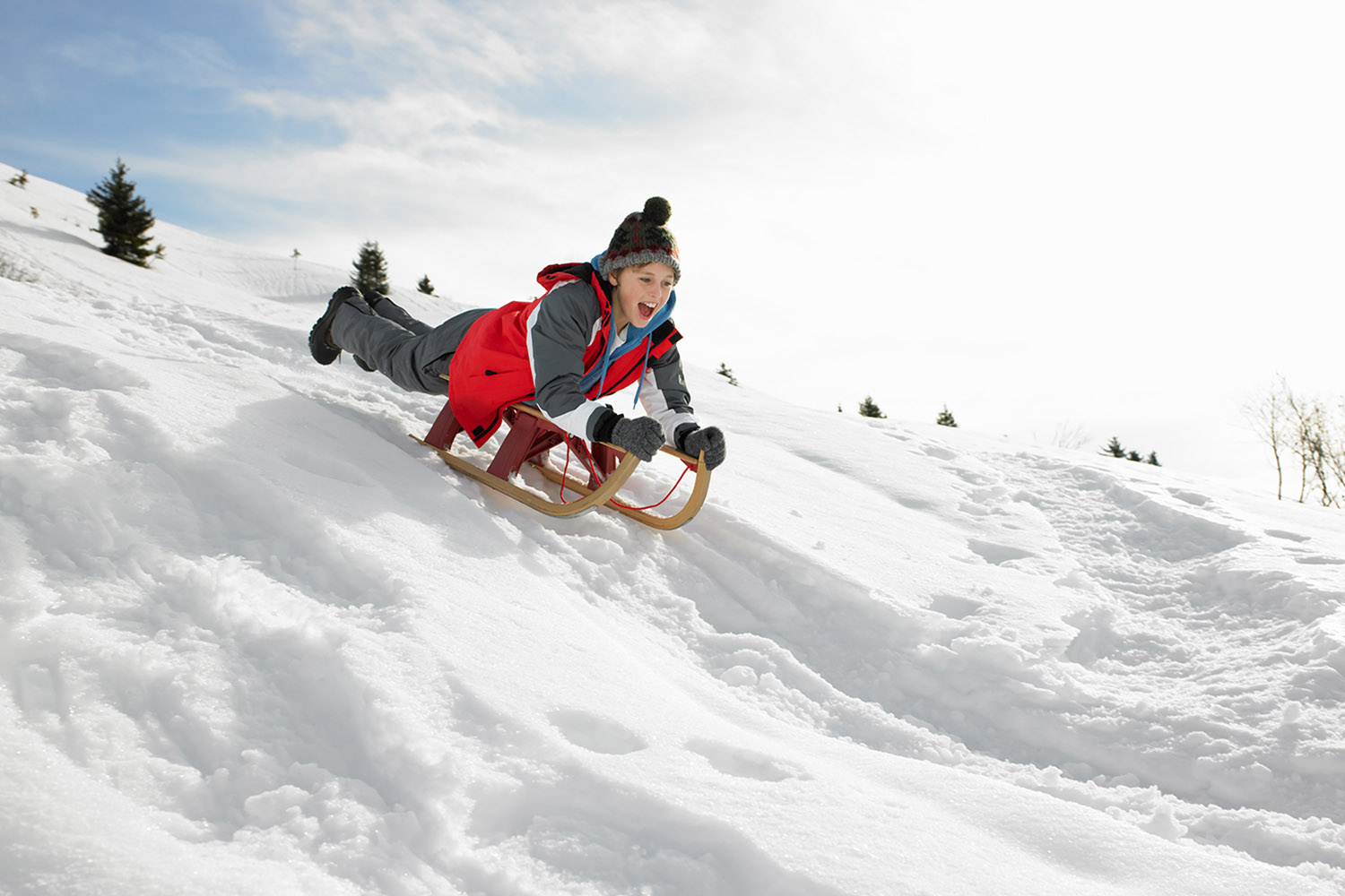 kid on a toboggan